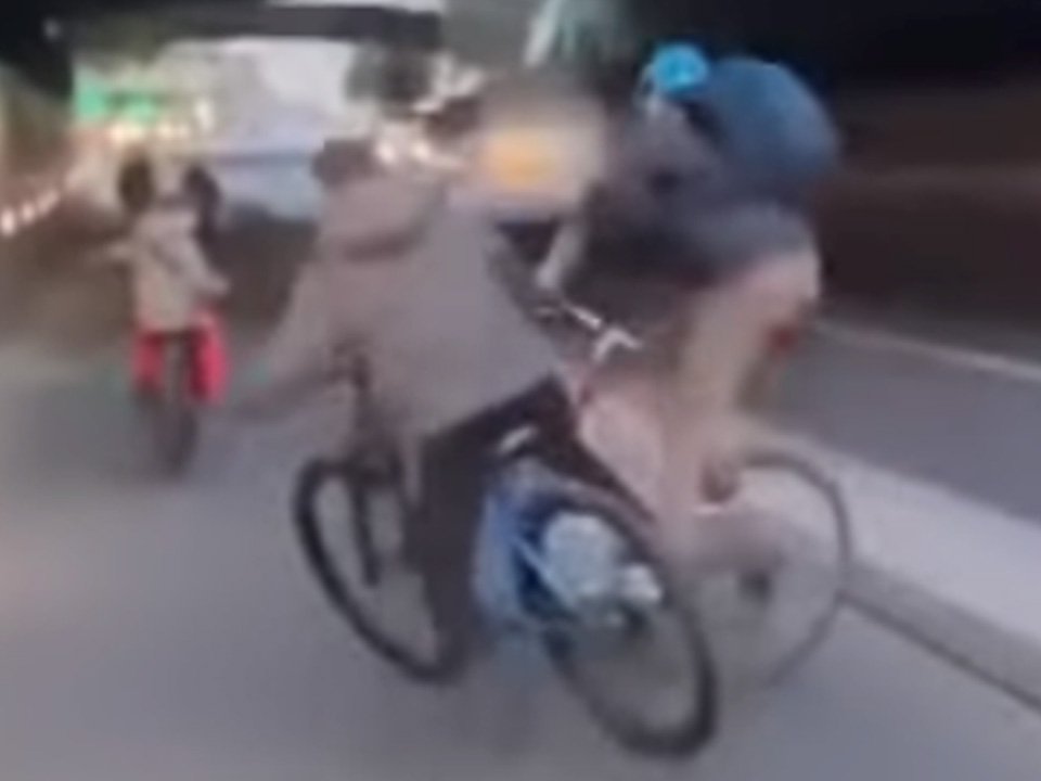 The man in the blue helmet went to push the younger cyclist (Picture: Instagram)