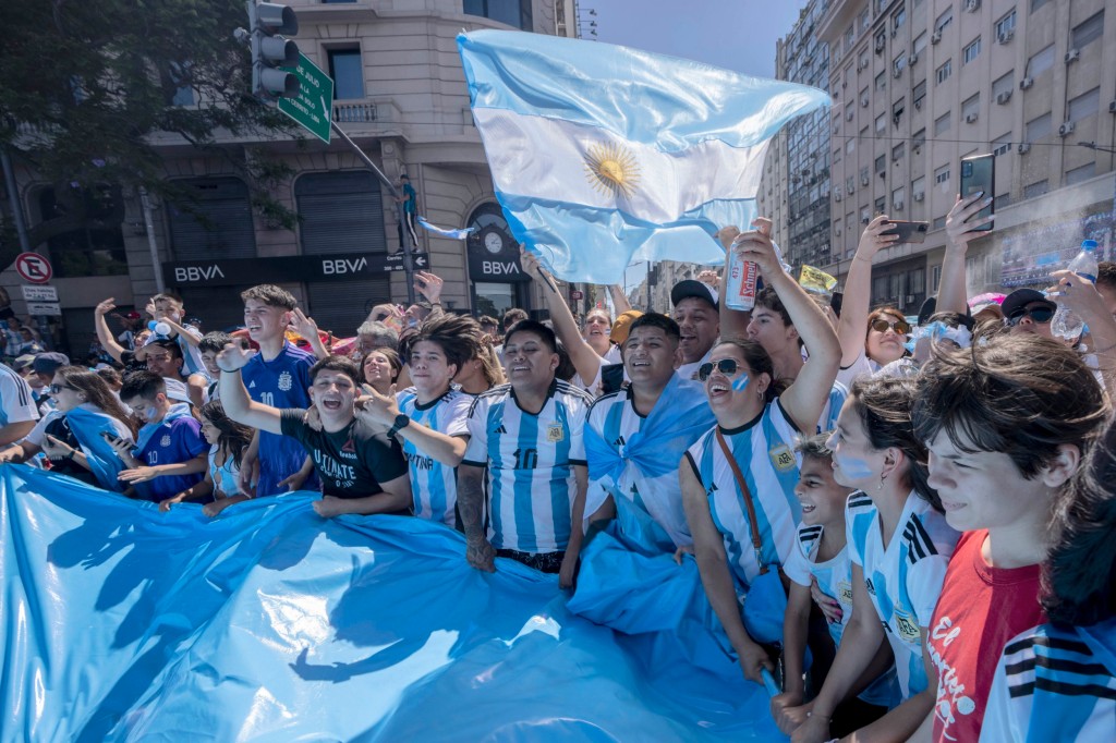 Argentina's fans celebrate at the end of the World Cup final match between Argentina and France in Buenos Aires