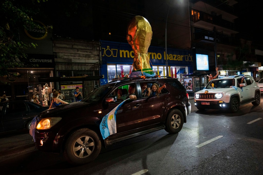 A replica World Cup trophy is paraded in Buenos Aires