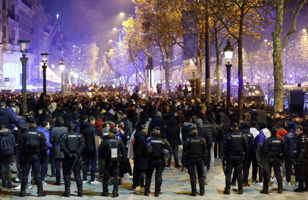 Police officers in riot gear are pictured after the semi final against Morocco