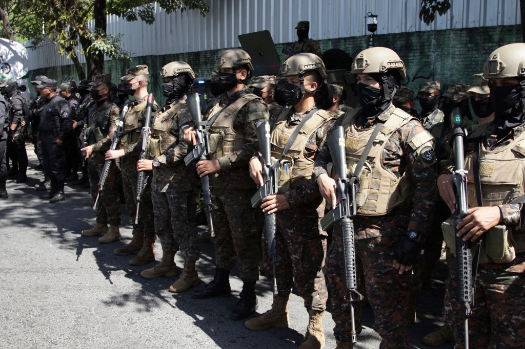 Soldiers arrive in Soyapango, El Salvador, Saturday, Dec. 3, 2022. The government of El Salvador sent 10,000 soldiers and police to seal off Soyapango, on the outskirts of the nation's capital Saturday to search for gang members. (AP Photo/Salvador Melendez)