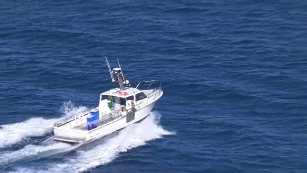 Picture of boat searching for lost teens in the sea