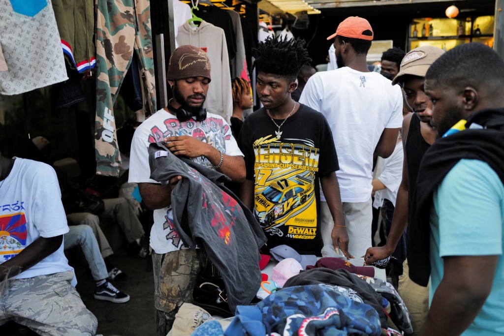 Other Folks save 2nd-hand clothes during a antique gala adventure in Accra, Ghana, December 20, 2022.</body></html>” /></div>
<p>REUTERS/Francis Kokoroko”/>Kids may also be noticed bartering over Purple Floyd, Grateful Dead and tie-dye tees (Image: Reuters) </p>
<p>Their message is discreet: buy secondhand, make a distinction. </p>
<p>‘Get Rid Of the whole perception that you only wear vintage while you are poor, or you only wear thrifted stuff whilst you don’t have money,’ stated creatie Myra Davis out of doors the Vintage Gala adventure. </p>
<p>‘It’s been right here for years. Why move and produce extra while there’s more than enough available to you?’</p>
<p><strong><strong><strong>Get involved with our information workforce by means of emailing us at webnews@metro.co.uk.</strong></strong></strong></p>
<p><strong>For extra stories like this, </strong><strong>test our news web page</strong>.</p>
<p>.</p>
                                                     <script>
    function pinIt()
    {
      var e = document.createElement('script');
      e.setAttribute('type','text/javascript');
      e.setAttribute('charset','UTF-8');
      e.setAttribute('src','https://assets.pinterest.com/js/pinmarklet.js?r='+Math.random()*99999999);
      document.body.appendChild(e);
    }
    </script>
                     <div class=