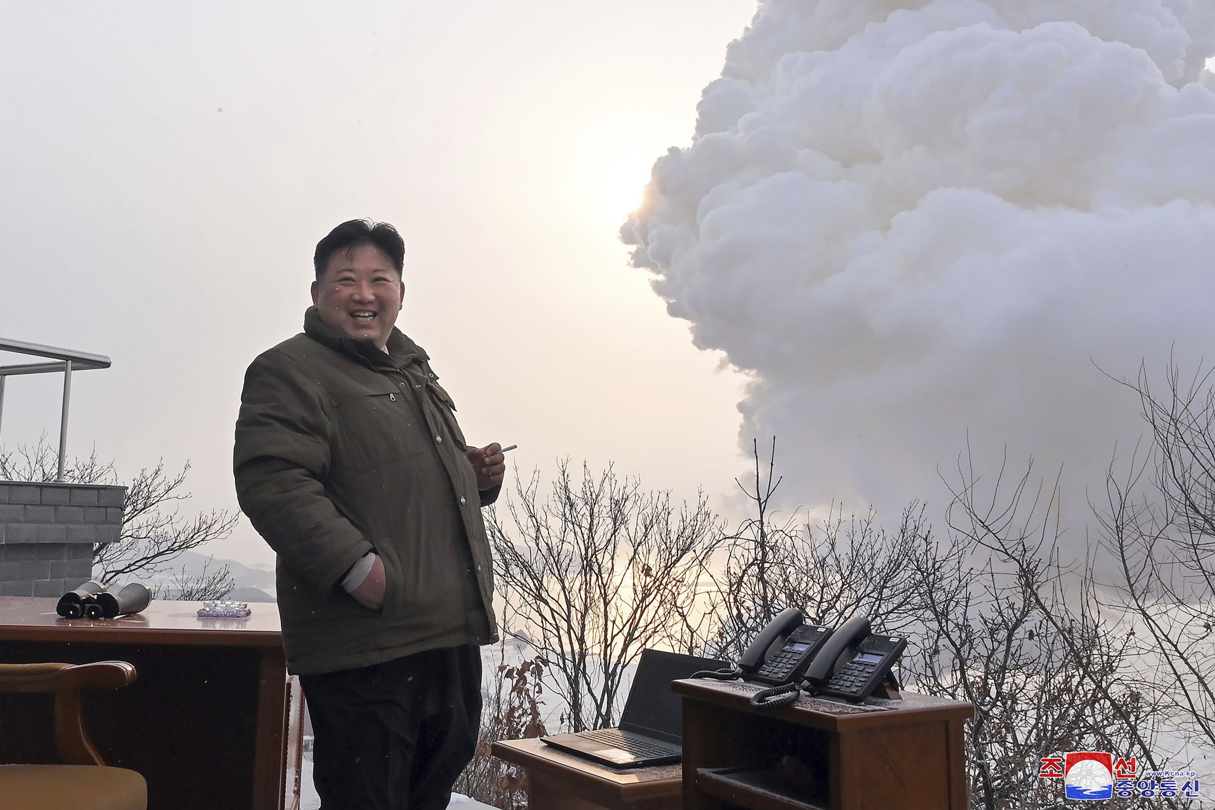 Kim Jong-Un holds cigarette and grins at new nuclear guns test