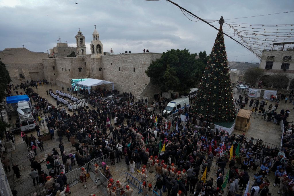 Latin Patriarch Pierbattista Pizzaballa greets worshippers in Manger Sq., adjacent to the Church of the Nativity, historically believed to be the birthplace of Jesus Christ, within the West Bank town of Bethlehem all through Christmas, Saturday, Dec.</body></html>” /></div>
<p>(AP Photograph/Mahmoud Illean)”/>Pilgrims flock close to the Church of the Nativity, historically believed to be the birthplace of Jesus Christ (Image: AP) </p>
<div><img loading=
