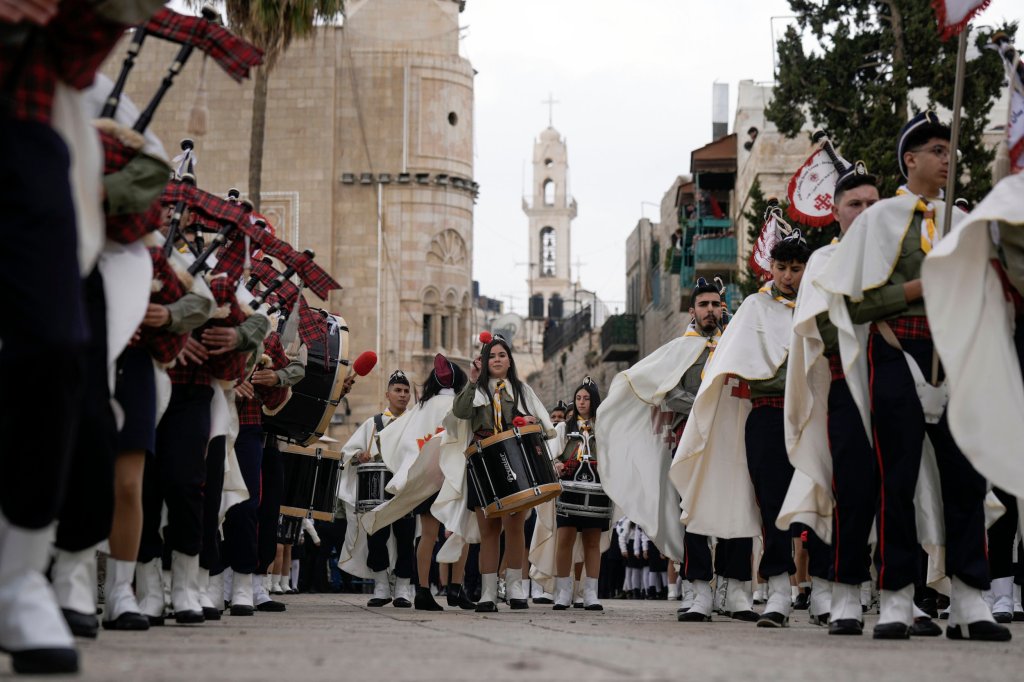 Palestinian scouts march all over Christmas parade against to the Church of the Nativity, traditionally believed to be the birthplace of Jesus Christ, within the West Bank the town of Bethlehem, Saturday, Dec.</body></html>” /></div>
<p>(AP Photo/Majdi Mohammed)”/>Palestinian scouts march throughout Christmas parade (Image: AP) </p>
<p>Pizzaballa walked through Manger Square, waving to smartly-wishers.</p>
<p>Later, he was to rejoice Midnight Mass in the nearby Church of the Nativity, built on the spot the place Christians believe Jesus was born.</p>
<p>Billions of Christians have been ushering within the holiday, wrapping up a tumultuous yr marred by means of battle and violence in lots of parts of the world.</p>
<p>In war-ravaged Ukraine, the glitzy lighting most often unfold over Kyiv’s Sophia Square are lacking due to regulations and gear cuts.</p>
<p>As An Alternative, a modest tree decorated with blue and yellow lighting slightly holiday the gloom of the square.</p>
<p>Mayor Vitali Klitschko has known as it the ‘Tree of Invincibility’.</p>
<p>In The United States Of America, a wild wintry weather hurricane continued to envelop a lot of the country, bringing blinding blizzards, freezing rain, flooding and lifestyles-threatening chilly that created mayhem for those traveling for the vacation.</p>
<p>Present-day fact was visual at Manger Square as banners showing footage of Palestinian prisoner Nasser Abu Hamid had been prominently displayed.</p>
<p>The veteran prisoner died of cancer remaining week in an Israeli prison medical institution after passing some twenty years in the back of bars for his conviction within the deaths of seven Israelis.</p>
<p><strong><strong><strong>Get involved with our information workforce by means of emailing us at webnews@metro.co.uk.</strong></strong></strong></p>
<p><strong>For extra tales like this, </strong><strong>test our news page</strong>.</p>
<p>.</p>
                                                     <script>
    function pinIt()
    {
      var e = document.createElement('script');
      e.setAttribute('type','text/javascript');
      e.setAttribute('charset','UTF-8');
      e.setAttribute('src','https://assets.pinterest.com/js/pinmarklet.js?r='+Math.random()*99999999);
      document.body.appendChild(e);
    }
    </script>
                     <div class=