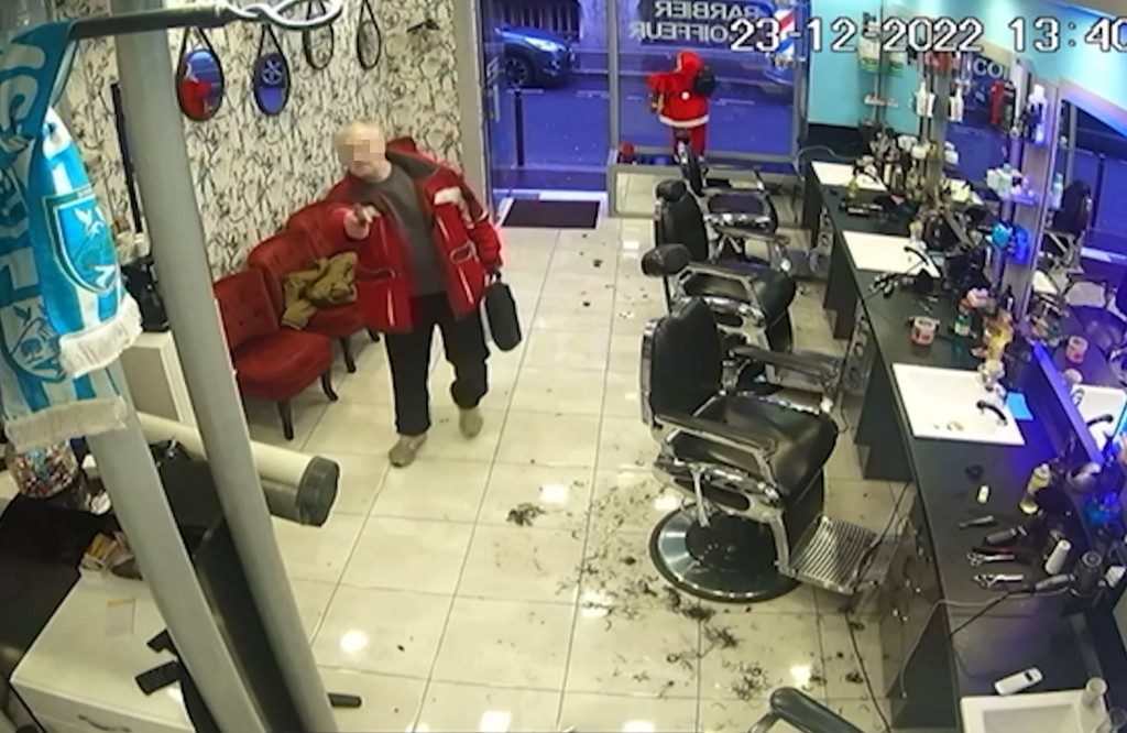 A screengrab taken from a surveillance video obtained by AFP on December 25, 2022 shows a 69-year-old French gunman entering a hairdressing salon on December 23, 2022 after he fired shots outside the Centre Ahmet Kaya