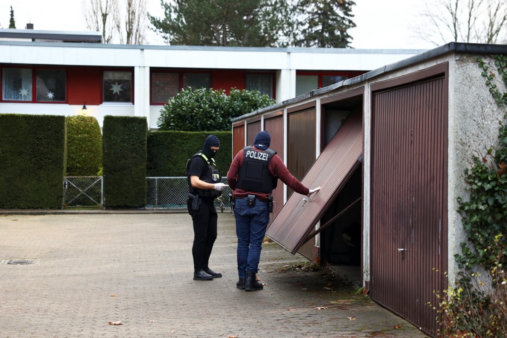 Police secures the area after 25 suspected members and supporters of a far-right group were detained during raids across Germany, in Berlin, Germany December 7, 2022. REUTERS/Christian Mang