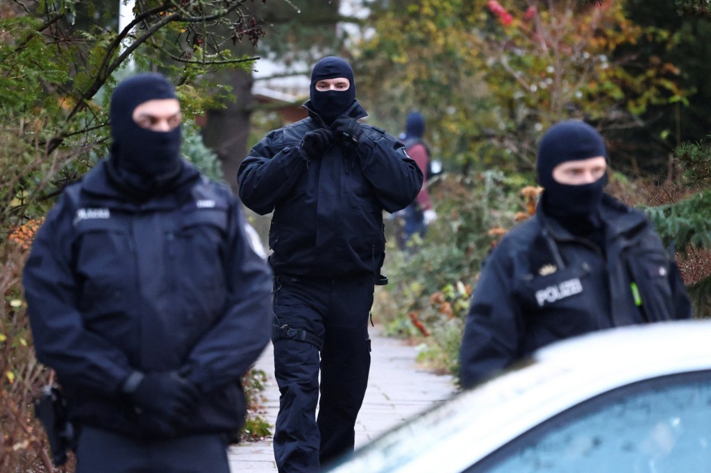 Police secures the area after 25 suspected members and supporters of a far-right group were detained during raids across Germany, in Berlin, Germany December 7, 2022. REUTERS/Christian Mang