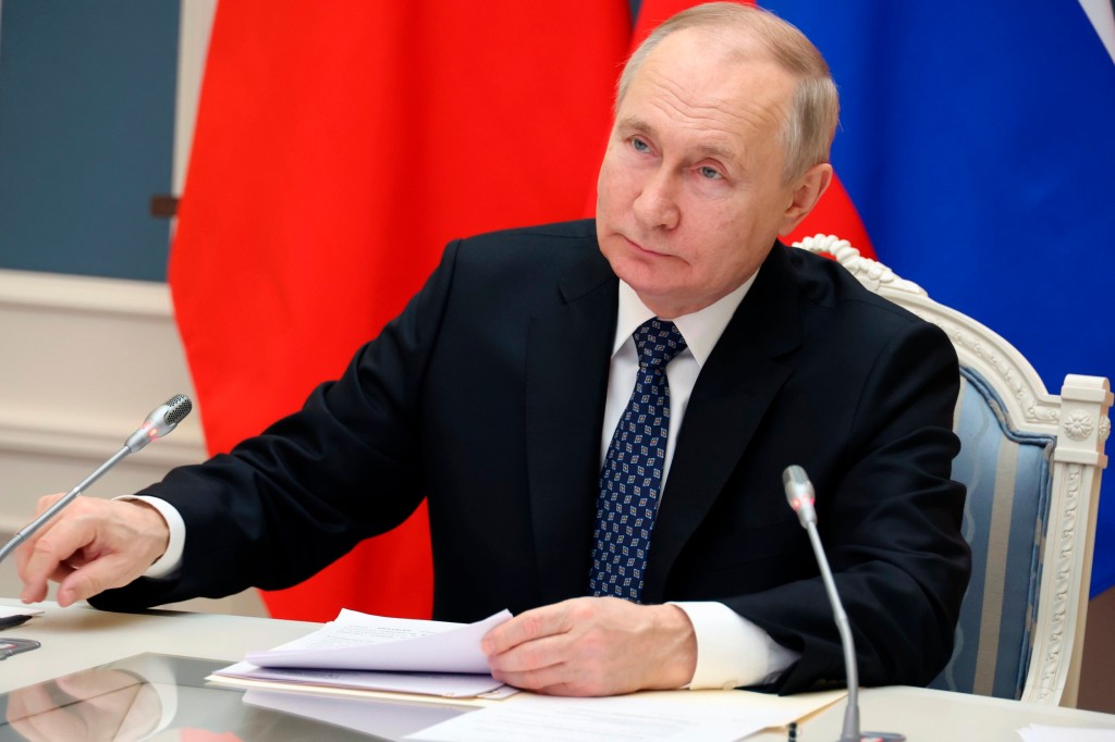 Russian President Vladimir Putin speaks during a meeting with Chinese President Xi Jinping via videoconference at the Kremlin in Moscow, Russia, Friday, Dec. 30, 2022. (Mikhail Klimentyev, Sputnik, Kremlin Pool Photo via AP)