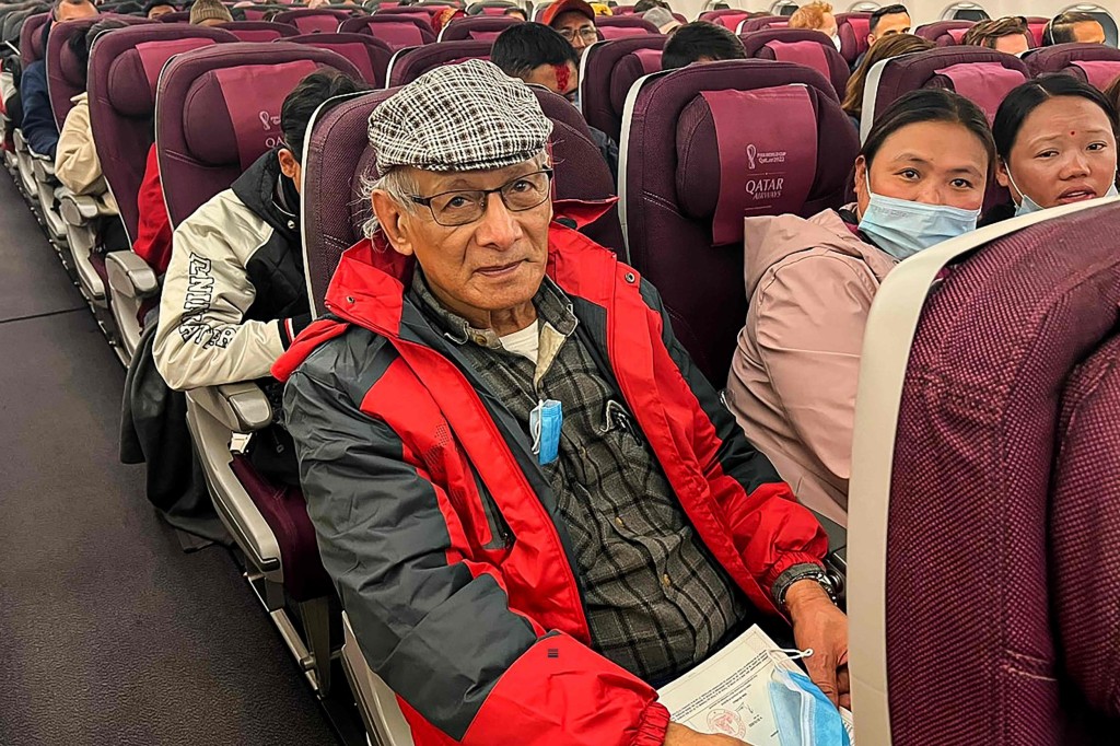 French serial killer Charles Sobhraj (C) sits in an aircraft departing from Kathmandu to France, on December 23, 2022. - French serial killer Charles Sobhraj, responsible for multiple murders in the 1970s across Asia, was freed on December 23 after spending almost 20 years in a Nepali prison. (Photo by Atish PATEL / AFP) (Photo by ATISH PATEL/AFP via Getty Images)