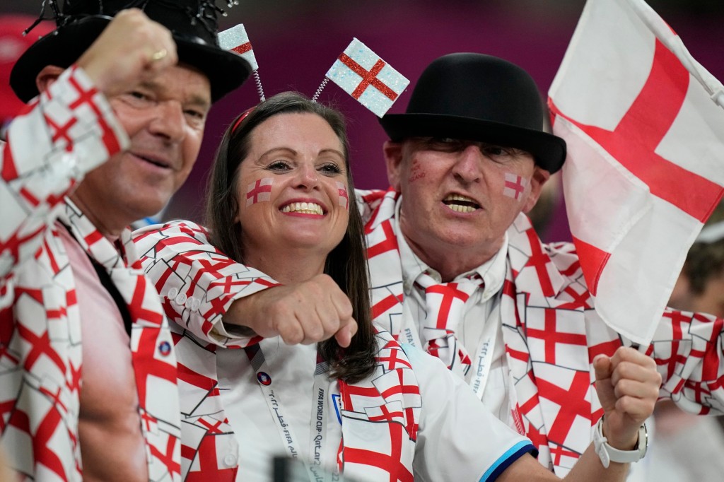 England supporters cheer for their team prior to the start of the World Cup group B soccer match between England and Wales, at the Ahmad Bin Ali Stadium in Al Rayyan, Qatar, Tuesday, Nov. 29, 2022. (AP Photo/Pavel Golovkin)