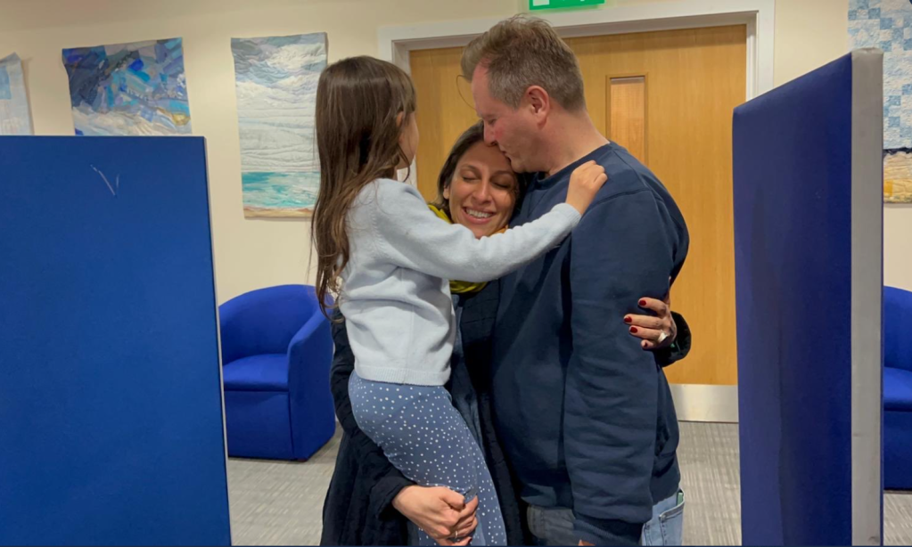 Nazanin Zaghari-Ratcliffe embraces her husband Richard and daughter Gabriella