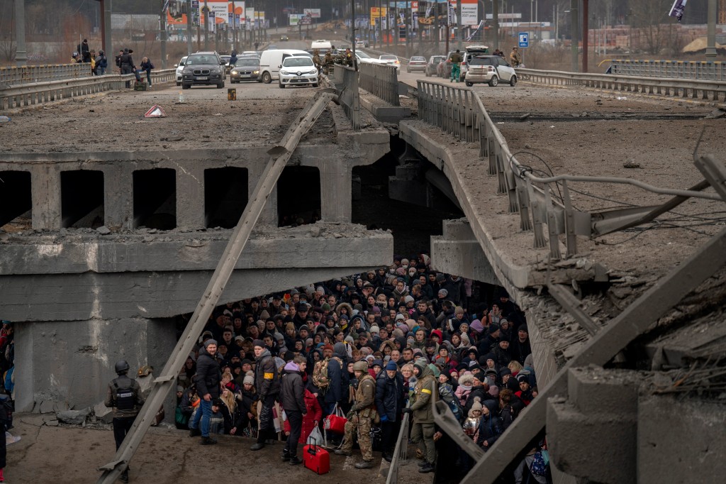 A crowd of Ukrainian people huddled.</body></html>” /></div>
<p>The fight of Irpin used to be already underneath means when this photograph was once taken, as Russian forces advanced on the town, that is subsequent to Kyiv, in a bid to take keep watch over of the capital. This crowd was once crossing the Irpin River trying to succeed in protection in March. (Image: AP Picture/Emilio Morenatti) </p>
<div><img loading=