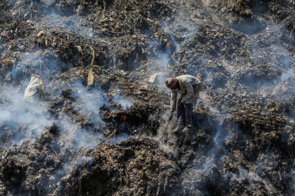 Steam rises around a man rummaging through the rubbish dump in Dandora, which receives more than 2,000 metric tonnes of waste from the capital city’s 4.5 million residents every day