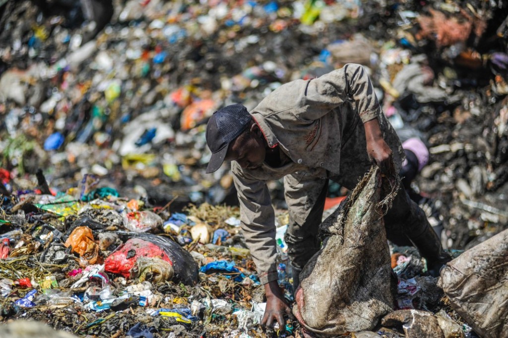 A man rummages through the rubbish dump in Dandora, which receives more than 2,000 metric tonnes of waste from the capital city’s 4.5 million residents every day