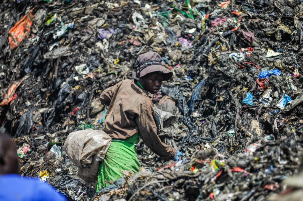 A woman rummages through the rubbish dump in Dandora, which receives more than 2,000 metric tonnes of waste from the capital city’s 4.5 million residents every day