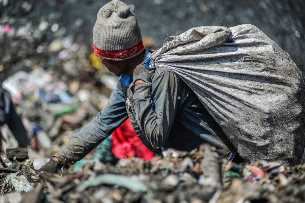 A man rummages through the rubbish dump in Dandora, which receives more than 2,000 metric tonnes of waste from the capital city’s 4.5 million residents every day