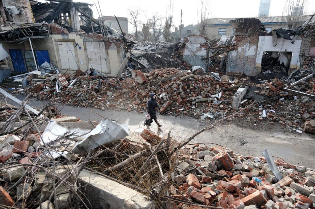 TORETSK, UKRAINE - JANUARY 20: A woman walks by destroyed buildings in the mining town of Toretsk, which is situated under 20 miles from the front lines of fighting on January 20, 2023 in Toretsk, Ukraine. Russia has stepped up its offensive in the Donetsk region since the start of the year, with the region's Kyiv-appointed governor accusing Russia of using scorched-earth tactics. (Photo by Spencer Platt/Getty Images)