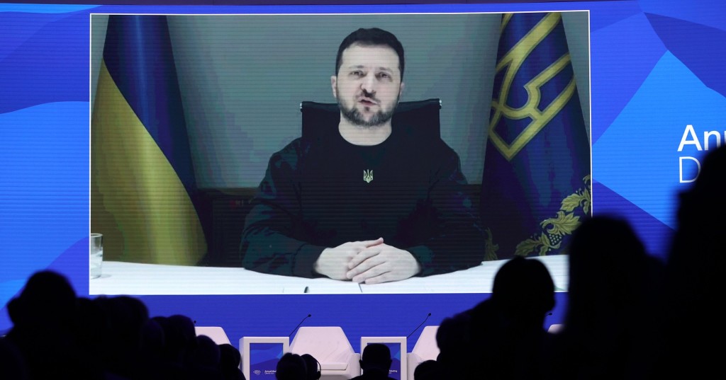 DAVOS, SWITZERLAND - JANUARY 18: Ukrainian President Volodymyr Zelensky on a screen as he speaks during the World Economic Forum (WEF) annual meeting via video link at the Congress Centre in Davos January 18, 2023. (Photo by Dursun Aydemir/Anadolu Agency via Getty Images)