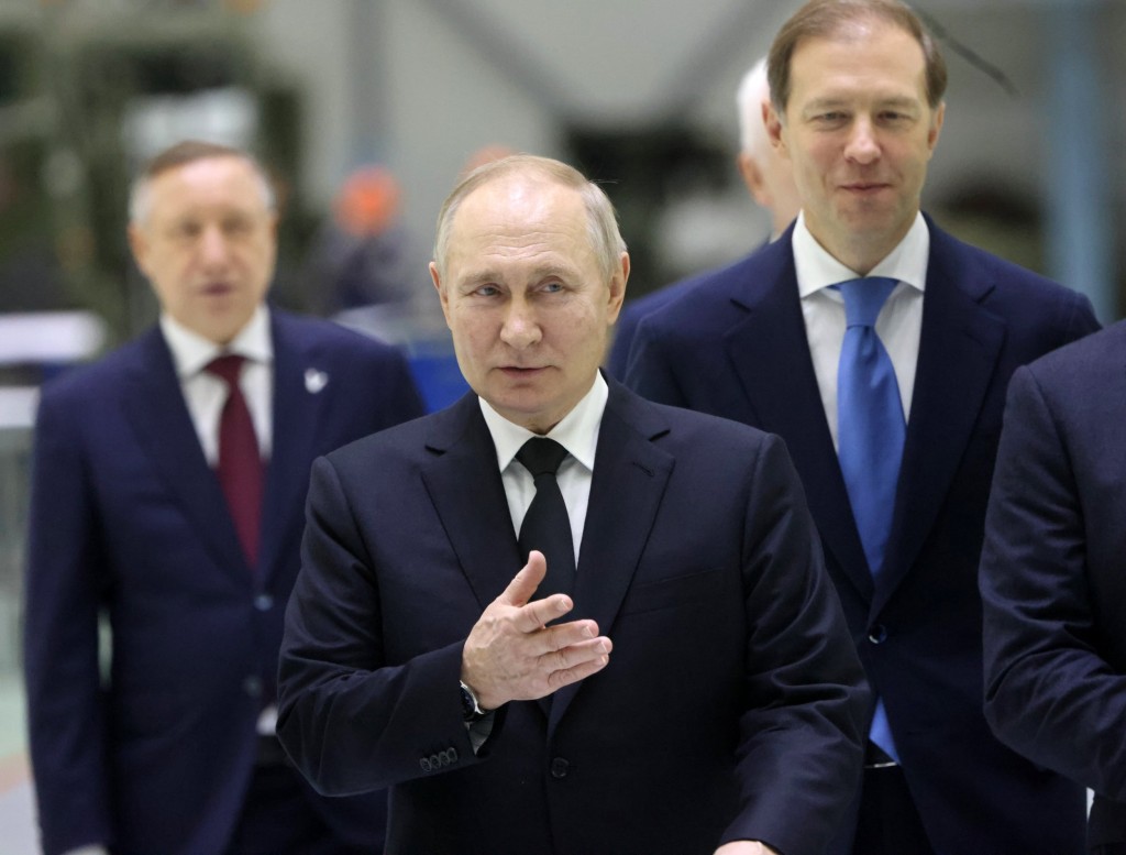 SAINT PETERSBURG, RUSSIA - JANUARY 18: (RUSSIA OUT) Russian President Vladimir Putin (C), Governor of Saint Petersburg Alexander Beglov (L), First Deputy Prime Minister Denis Manturov (R) entetr the hall during the meeting with workers at the Obukhov State Plant on January 18, 2023, in Saint Petersburg, Russia. Vladimir Putin arrived to Saint Petersburg for a one-day visit. (Photo by Contributor/Getty Images)