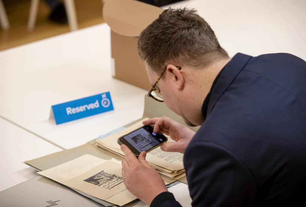 Mandatory Credit: Photo by Hollandse Hoogte/Shutterstock (13692636b) THE HAGUE - A journalist looks at a treasure map to a possible Nazi treasure in Ommeren in the National Archives during the annual Open Access Day. Many archived documents are made public on this day. National Archives Is Opening Numerous Files Again, Hague, Netherlands - 03 Jan 2023