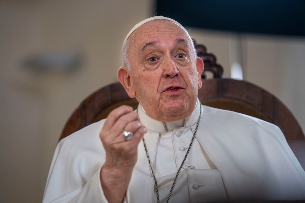 Pope Francis speaks during an interview with The Associated Press at The Vatican, Tuesday, Jan. 24, 2023. Pope Francis said he hasn't even considered issuing norms to regulate future papal resignations and says he plans to continue on for as long as he can as bishop of Rome, despite a wave of attacks against him by some top-ranked cardinals and bishops. (AP Photo/Domenico Stinellis)