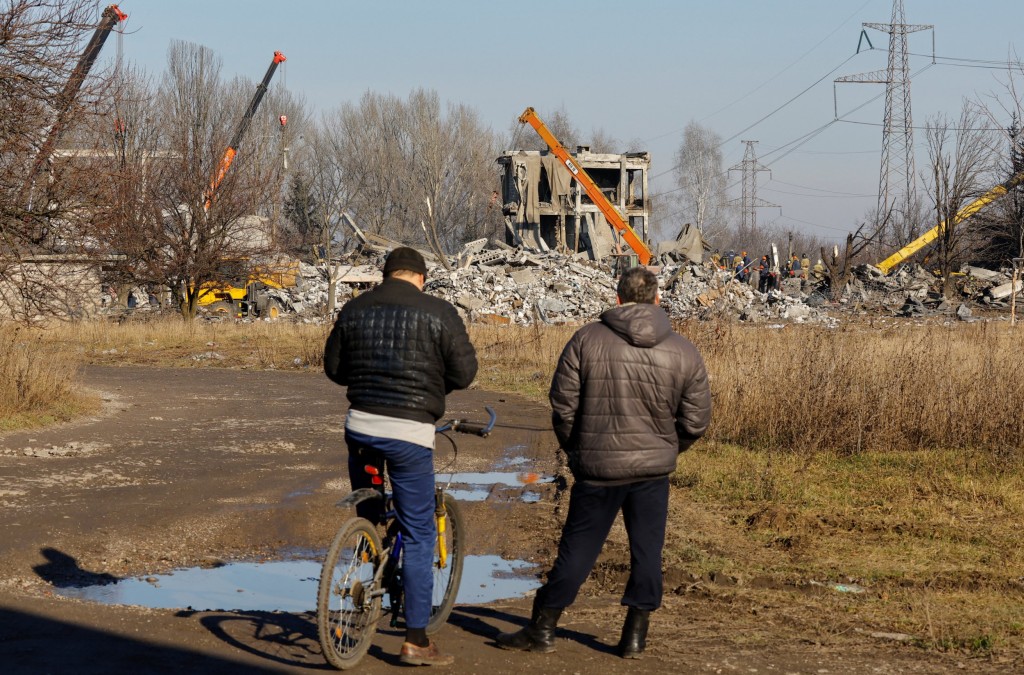 Males watch staff putting off particles of a destroyed development presupposed to be a vocational faculty used as brief lodging for Russian infantrymen, SIXTY THREE of whom had been killed in a Ukrainian missile strike as mentioned the former day by means of Russia's Defence Ministry, within the process Russia-Ukraine battle in Makiivka (Makeyevka), Russian-managed Ukraine, January THREE, 2023.</body></html>” /></div>
<p>REUTERS/Alexander Ermochenko”/>The missile attack happened on New Yr’s Day (Picture: Reuters) </p>
<div>
<p>To view this video please permit JavaScript, and consider upgrading to a web browser that helps HTML5 video</p>
</p></div>
<p>However Ukraine claims some 400 soldiers were killed – and any other THREE HUNDRED wounded – within the attack on a college for conscripts.</p>
<p>it’s believed to be the worst unmarried loss for Putin’s army within the 10-month invasion.</p>
<p>‘A commission is operating to analyze what came about,’ Mr Sevryukov wired.</p>
<p>‘However even lately it is clear that the primary reason why was once staff switching on and the usage of – regardless of the ban – mobile phones inside the enemy achieve zone.</p>
<p>‘This allowed the enemy to detect the staff’s coordinates for the missile strike.’</p>
<div><img loading=