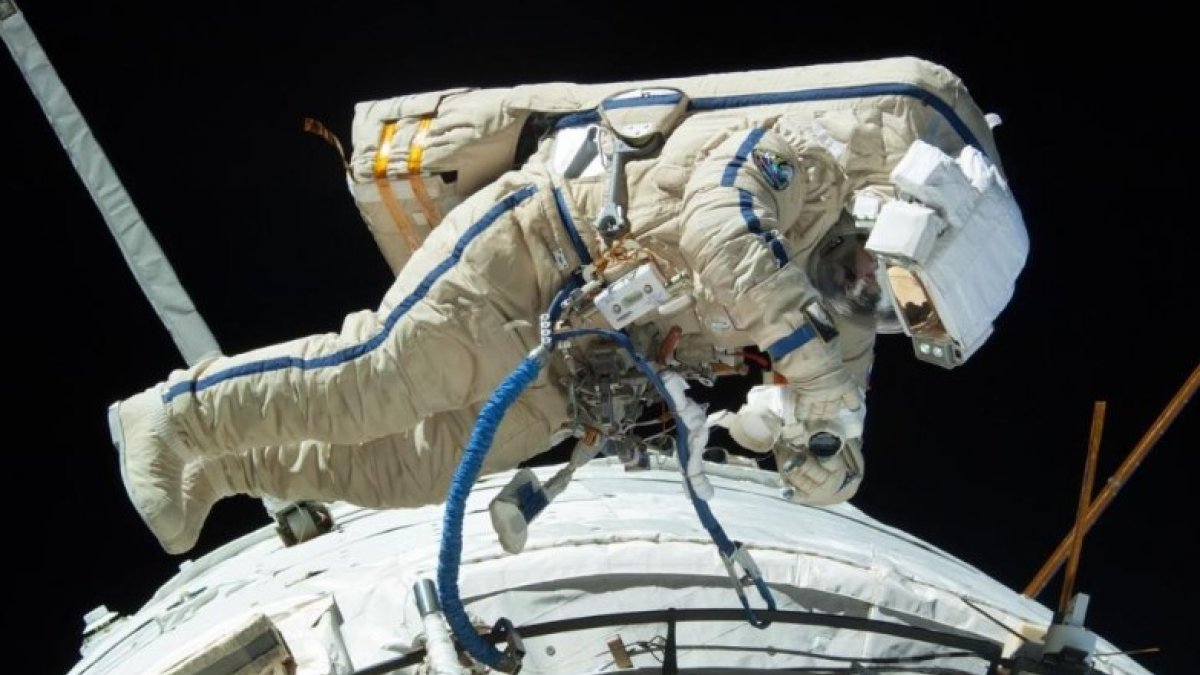 Russian cosmonauts move on a spacewalk