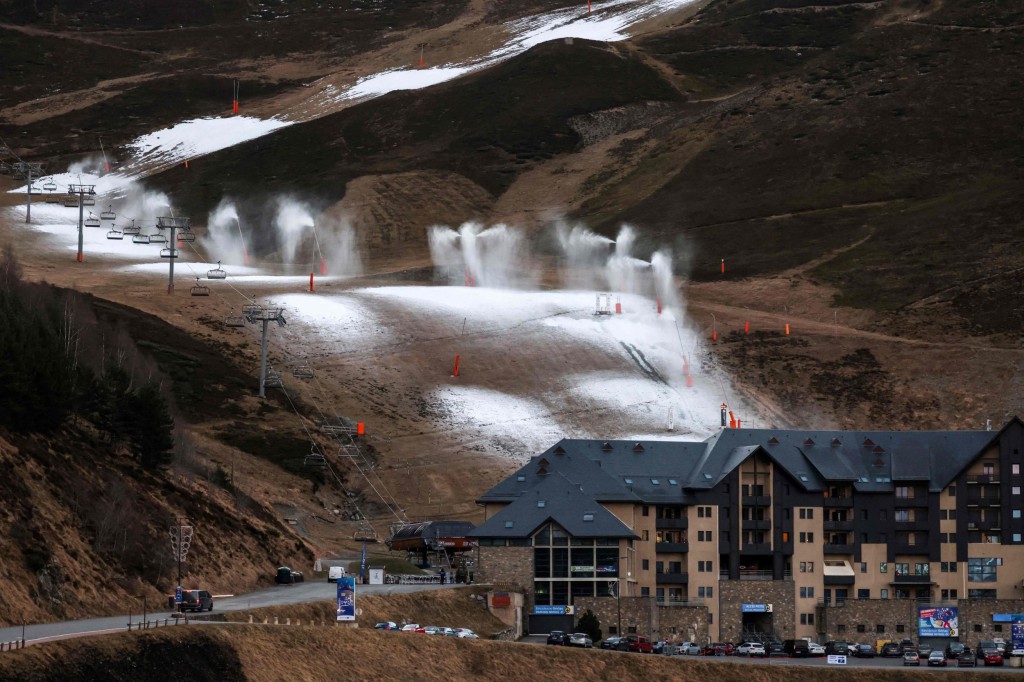 This photograph shows a general view of snow cannons operating due to lack of snow at the Peyragudesski resort, southwestern France on January 5, 2023. (Photo by Charly TRIBALLEAU / AFP) (Photo by CHARLY TRIBALLEAU/AFP via Getty Images)