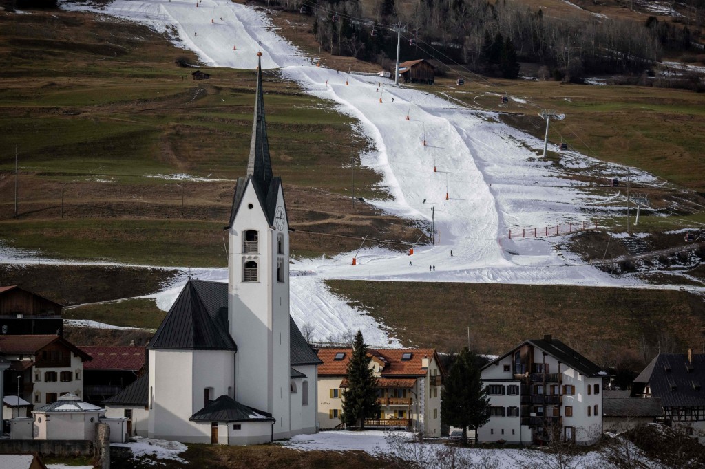 A ski slope made by snow machine is seen in the Swiss Alpine resort of Savognin on December 30, 2022. - The turnover of Swiss ski lift operators melts at the start of the season, with mild weather in the Alps, showing a drop of around 9% compared to the previous year, said on January 4, 2023 the professional organization which represents the interests of the branch. (Photo by Fabrice COFFRINI / AFP) (Photo by FABRICE COFFRINI/AFP via Getty Images)