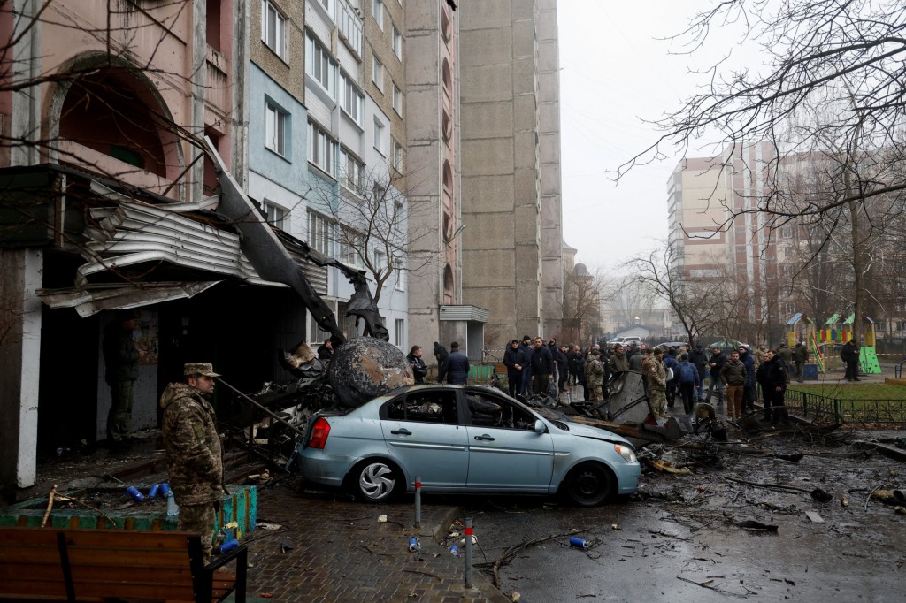 A view shows the site where a helicopter falls on civil infrastructure buildings, amid Russia's attack on Ukraine, in the town of Brovary, outside Kyiv, Ukraine, January 18, 2023. REUTERS/Valentyn Ogirenko