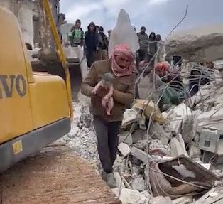 UNCLEARED GRABS - Pregnant woman GIVES BIRTH while buried under rubble in Syria: Newborn baby is rescued...but the mother 'tragically loses her life' following devastating earthquake