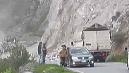 Drivers flee from cars as landslide wipes out road