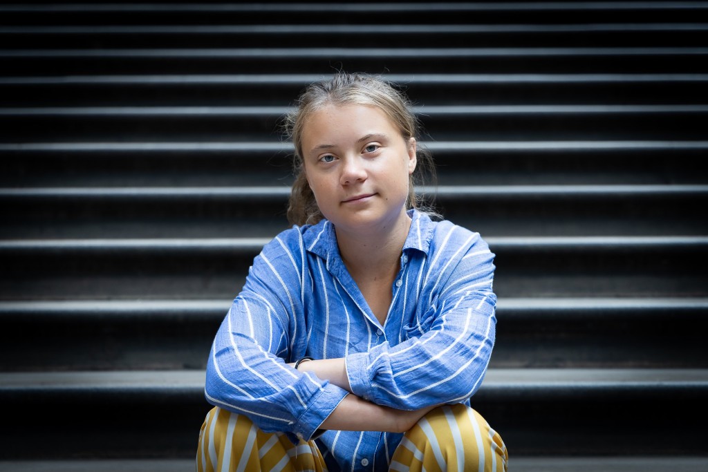 GRETA THUNBERG LONDON, ENGLAND - JUNE 27: Climate activist Greta Thunberg sits for a photo on the steps of the Museum???s central Hintze Hall at Natural History Museum on June 27, 2022 in London, England. Thunberg teamed up with the Natural History Museum to produce an event for school students centred around biodiversity loss, one of the themes of her forthcoming book, The Climate Book. (Photo by Tim Whitby/Getty Images)