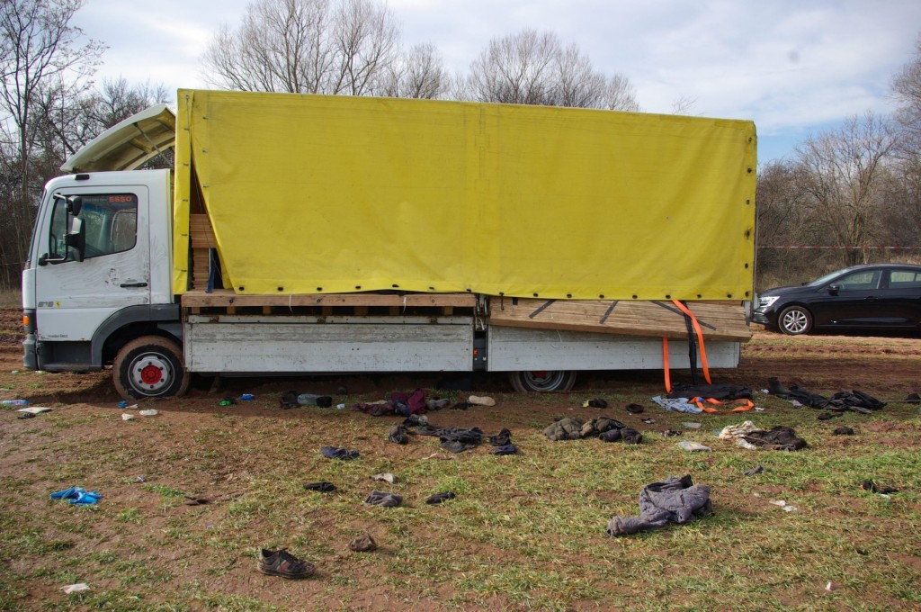 This handout photograph released by the Bulgarian Prosecutor's Office on February 18, 2023, shows the abandoned truck, in which eighteen migrants have been found dead inside the day before, near the village of Lokorsko, some 20 kilometres (12 miles) north-east of Sofia. - The truck was transporting 52 people hidden under wooden planks, and 18 died from suffocation and The 34 people who were rescued on February 17, 2023 were taken to hospital. (Photo by Handout / BULGARIAN PROSECUTORS OFFICE / AFP) / RESTRICTED TO EDITORIAL USE - MANDATORY CREDIT