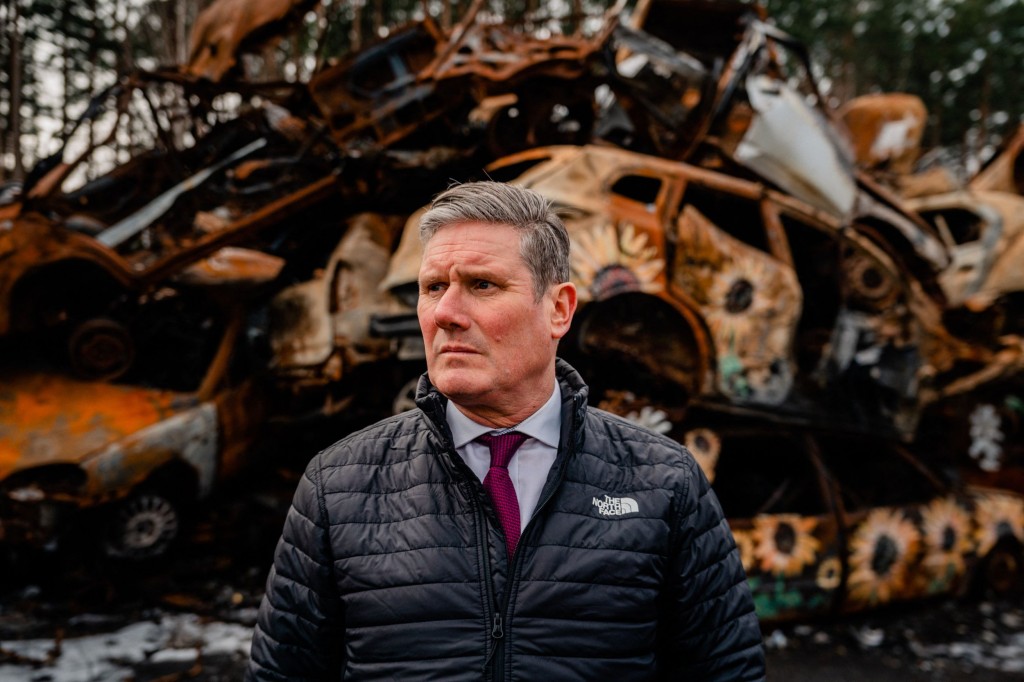 Britain's main opposition Labour Party leader Keir Starmer visits the cemetery of damaged civilian cars in the town of Irpin, near Kyiv, on February 16, 2023, amid the Russian invasion of Ukraine. (Photo by Dimitar DILKOFF / AFP) (Photo by DIMITAR DILKOFF/AFP via Getty Images)