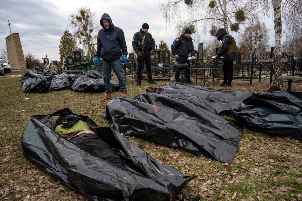 REPORT - Police inspect the killing of civilians in Bucha, Ukraine on the outskirts of Kyiv, before bringing the corpses to a morgue, Wednesday, April 6, 2022.</body></html>” /></div>
<p>Other People created a large luminous signal ??????????????, this means that ‘kids’ in Russian, the similar sign that used to be supposed to protect the theatre in Mariupol towards a bomb assault. no less than 30 people have been killed and about ONE HUNDRED others injured in this large-scale attack. EPA/MARTIN DIVISEK”/>People take part within the Light for Mariupol peace rally in front of the National Theatre construction in Prague, Czech Republic (Image: EPA) </p>
<div><img loading=