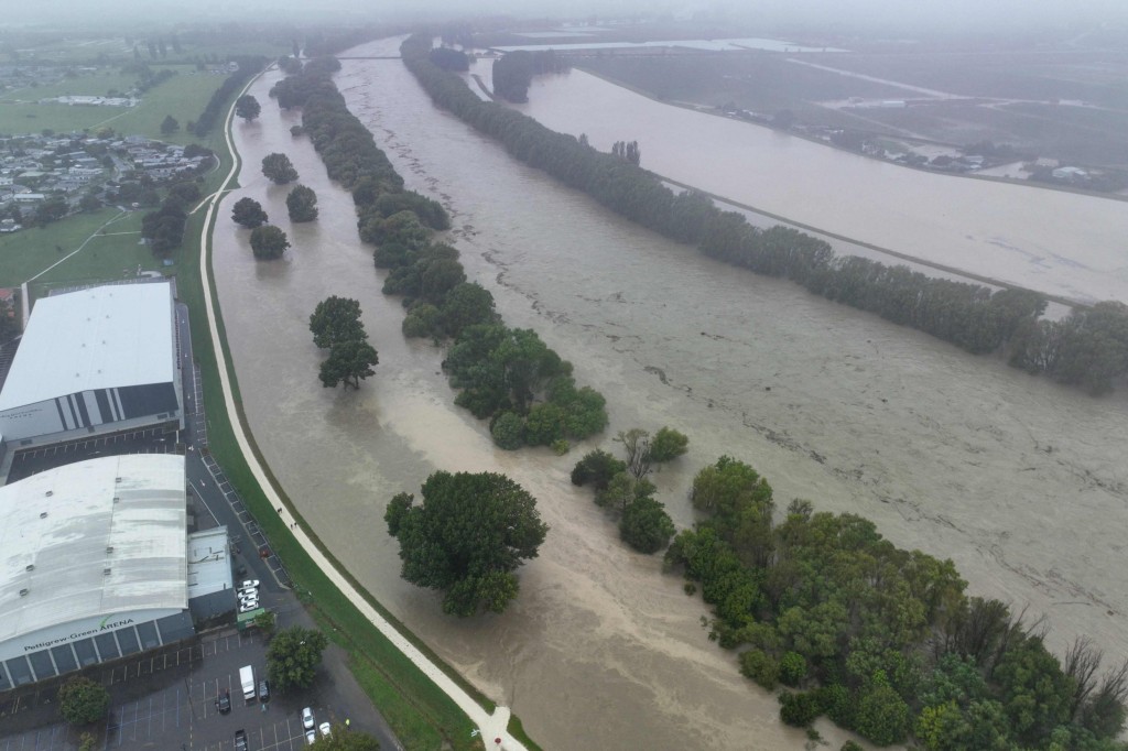 An aerial photo taken on February 14, 2023 shows the swollen Tutaekuri River after Cyclone Gabrielle made landfall near the city of Napier. - New Zealand declared a national state of emergency on February 14 as Cyclone Gabrielle swept away roads, inundated homes and left more than 100,000 people without power. (Photo by AFP) / New Zealand OUT (Photo by STR/AFP via Getty Images)