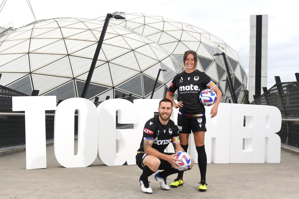 MELBOURNE, AUSTRALIA - JANUARY 30: Josh Brillante and Kayla Morrison of the Melbourne Victory pose with the Pride Cup trophy during a media opportunity launching the A-Leagues pride round at AAMI Park on January 30, 2023 in Melbourne, Australia. (Photo by Morgan Hancock/Getty Images) 11757377