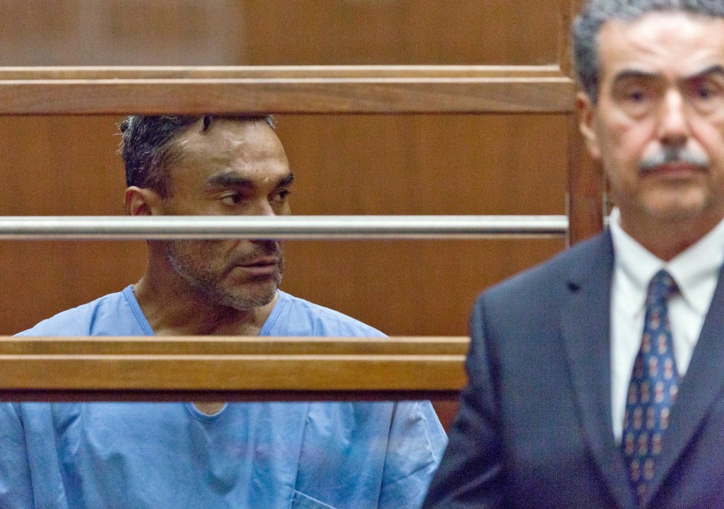 FILE - In this Sept. 26, 2018, file photo, Ramon Escobar, with an unidentified attorney, appears at a hearing in Los Angeles County Superior Court. Police will seek a fourth murder charge against Escobar, suspected in a string of brutal and deadly beatings in the Los Angeles area, after another victim died, officials said Wednesday, Oct. 3. (AP Photo Damian Dovarganes, File)